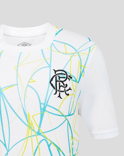 White shirt with blue and yellow abstract patterns and a logo on a gray background