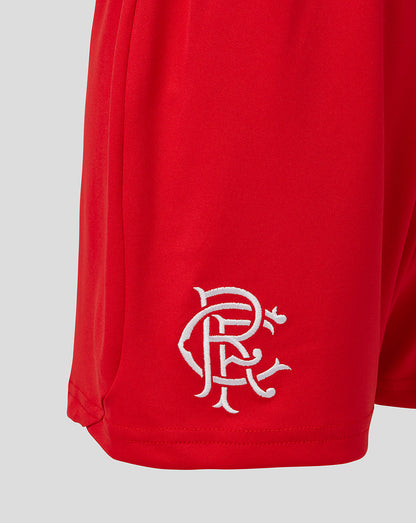 Red shorts with a white logo on a light gray background