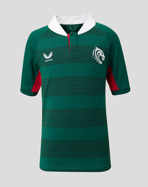 A green short-sleeve rugby jersey with horizontal dark stripes, a white collar, red side panels, and white embroidered logos on the chest, shown against a solid gray background.