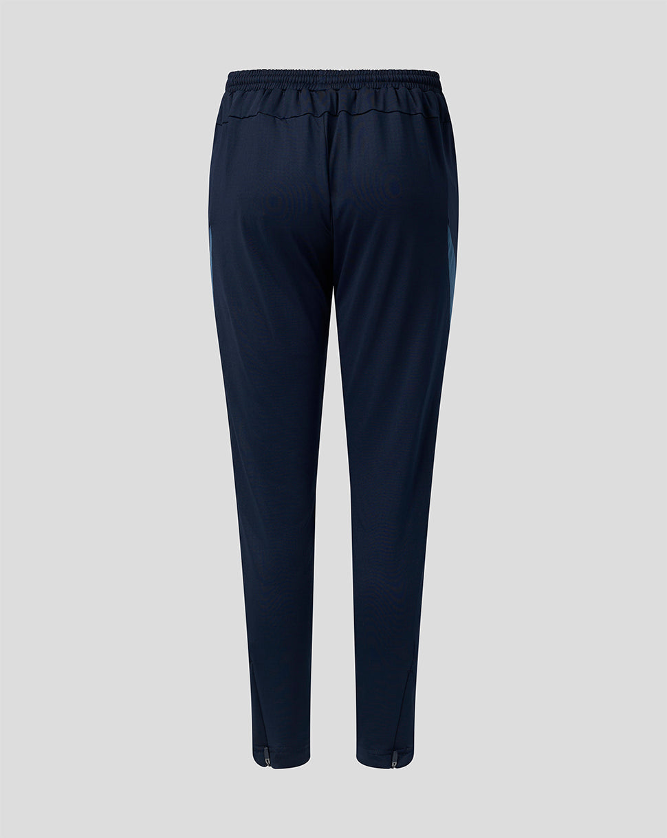 Back view of navy FC Twente Junior training pants with elastic waistband and blue side panels