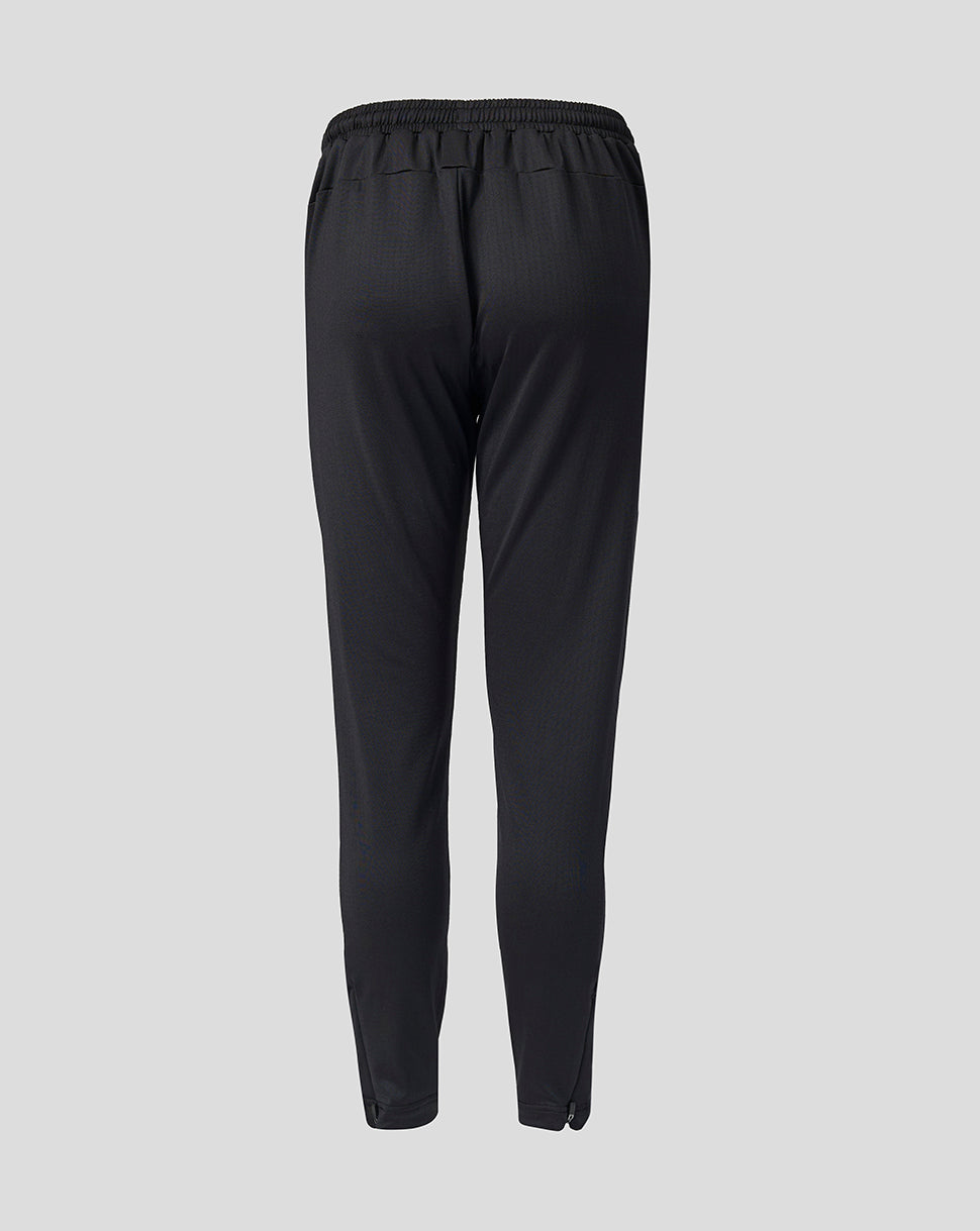Back view of black Feyenoord Junior training pants with an elastic waistband.