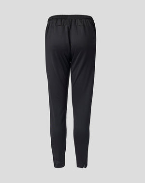 Back view of black Feyenoord Junior training pants with an elastic waistband.