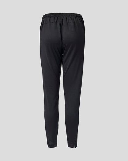 Back view of black Feyenoord Junior training pants with an elastic waistband.