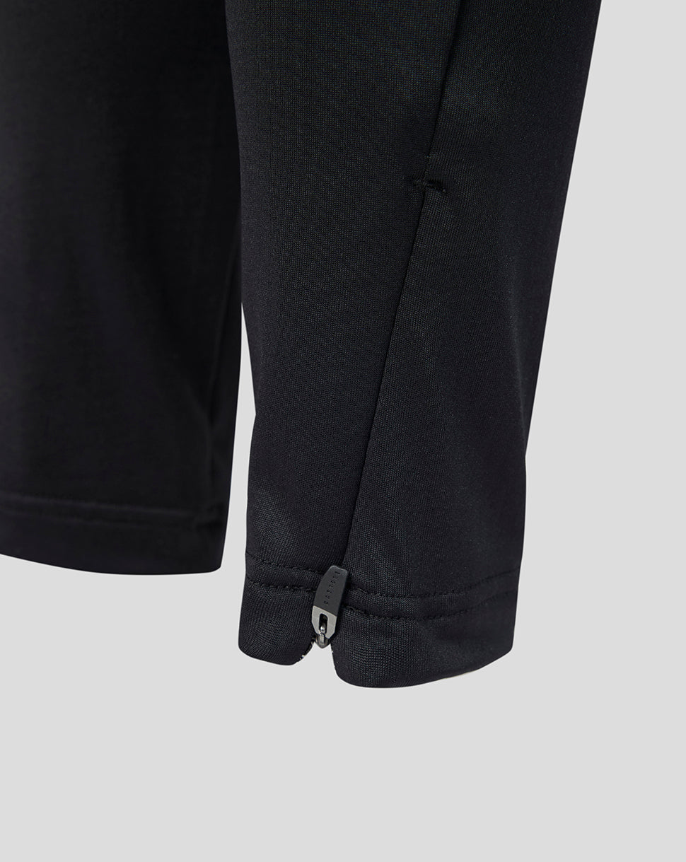 Close-up of the black Feyenoord Junior training pants cuff showing a small zipper.