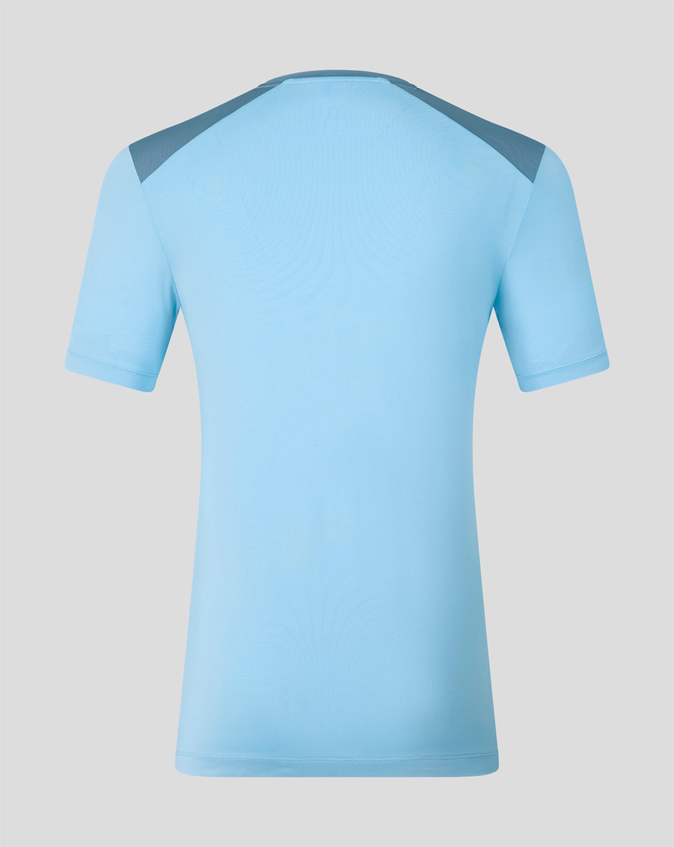 Back view of light blue FC Twente 26/27 training shirt with dark shoulder panels.