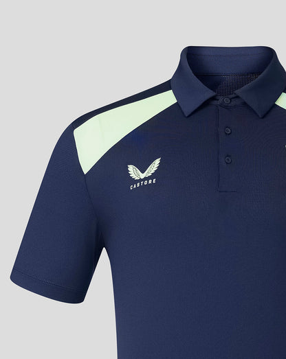 Front view of navy Athletic Club training polo with mint shoulder panel and crest on left chest