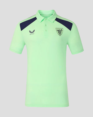 Front view of mint green Athletic Club training polo shirt with navy shoulder panels and crest badge