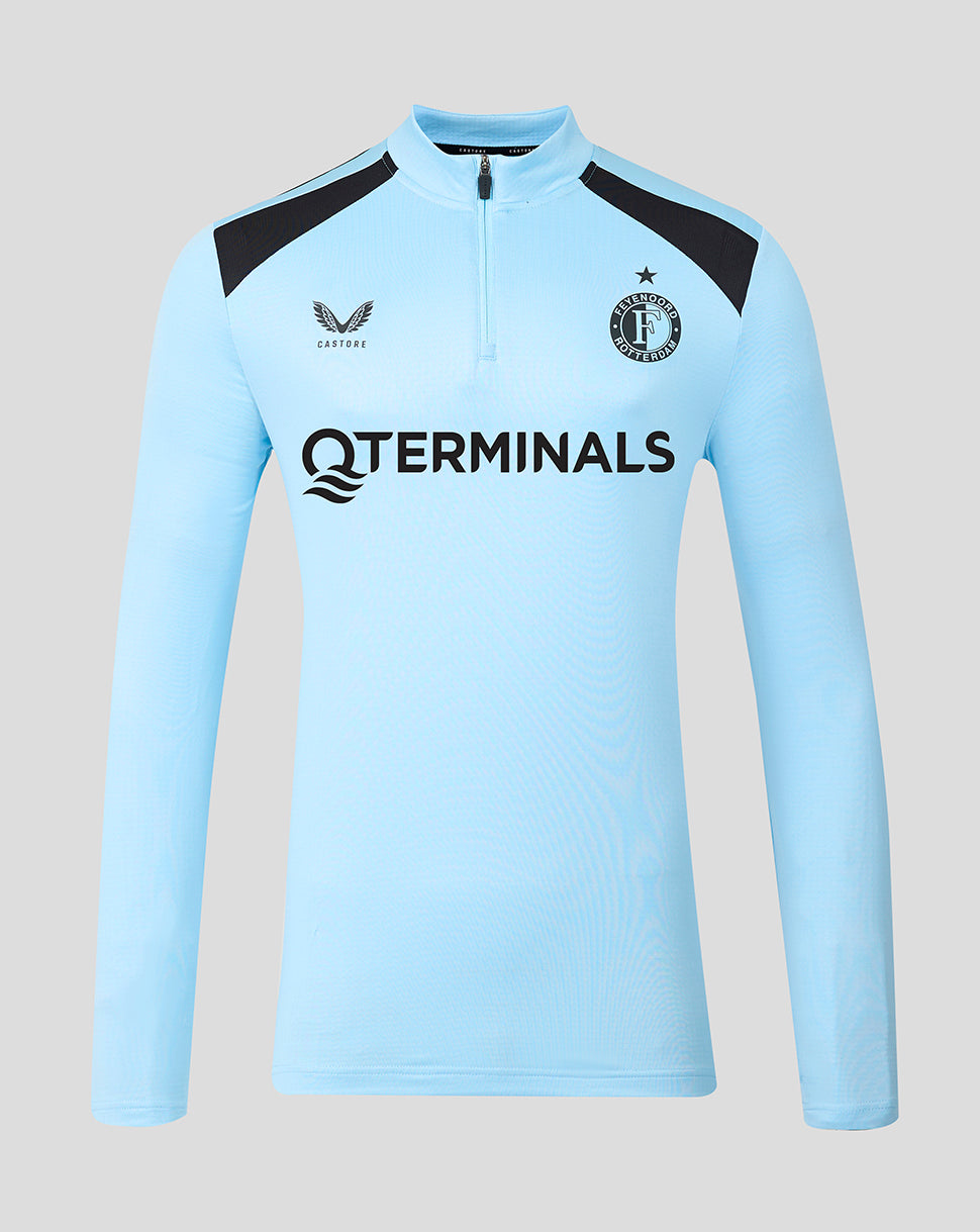 Light blue Feyenoord training midlayer with black shoulder panels, team crest on chest, and TERMINALS sponsor across the front