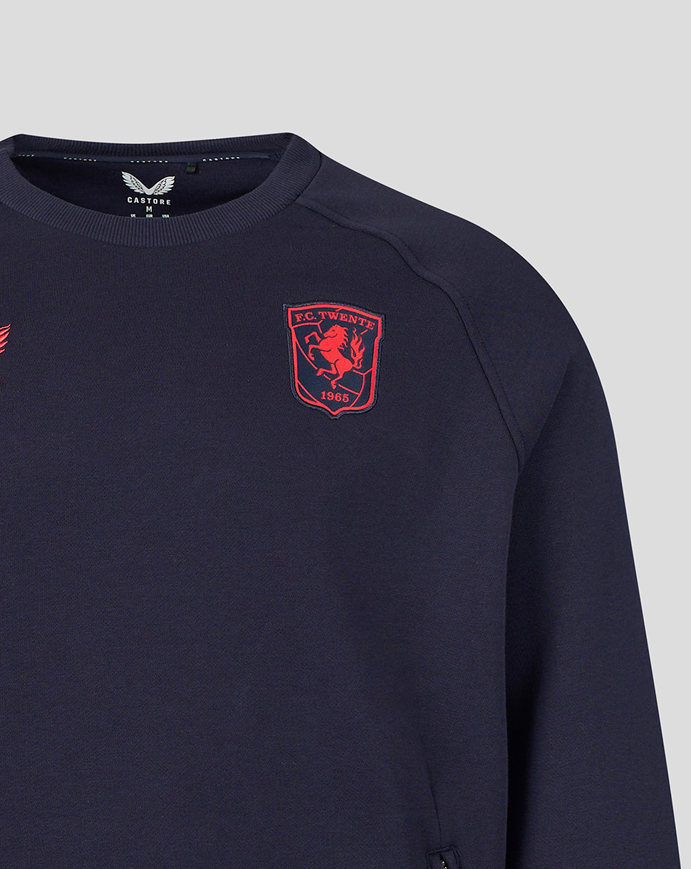 Front close up of navy FC Twente Adapt Travel Fleece Sweatshirt showing red club crest on the chest.