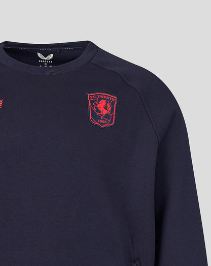 Front close up of navy FC Twente Adapt Travel Fleece Sweatshirt showing red club crest on the chest.