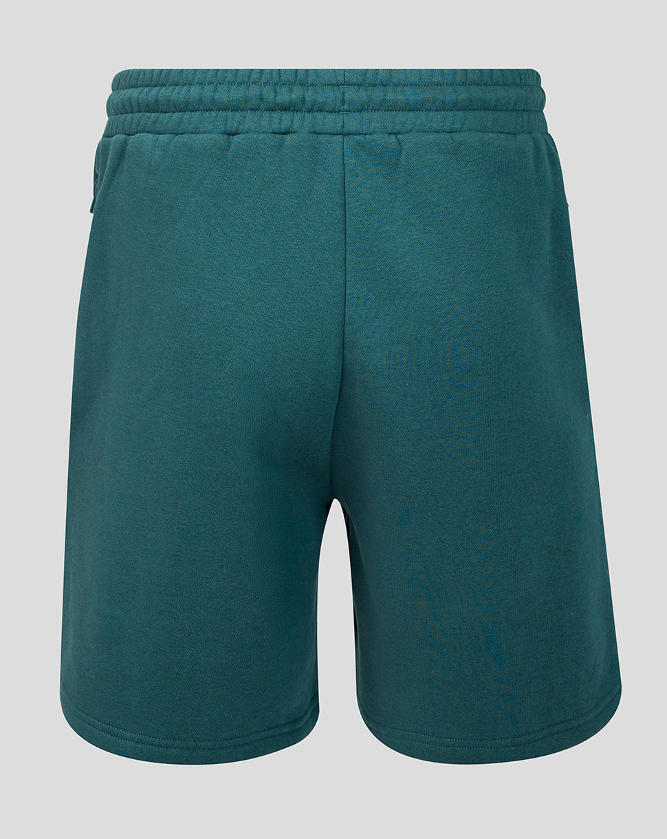Back view of teal Athletic Club Junior travel shorts with elastic waistband and center seam.
