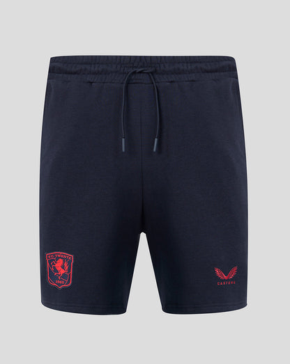 Front view of navy FC Twente travel fleece shorts with red crest on left leg and Castore logo on right leg.