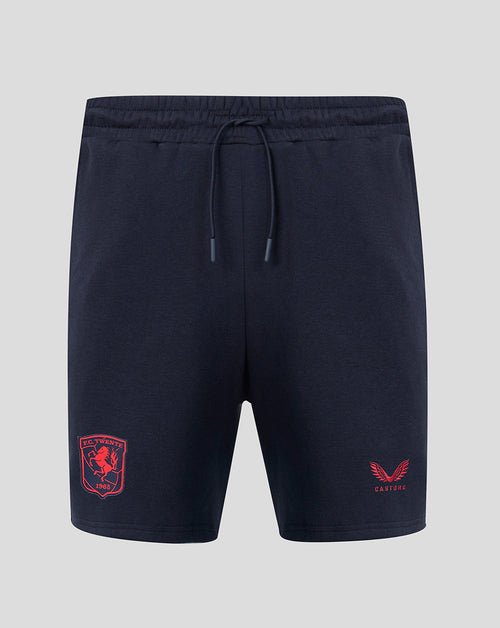 Front view of navy FC Twente travel fleece shorts with red crest on left leg and Castore logo on right leg.