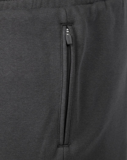 Close-up of a vertical zippered side pocket on dark gray Travel Fleece Shorts.