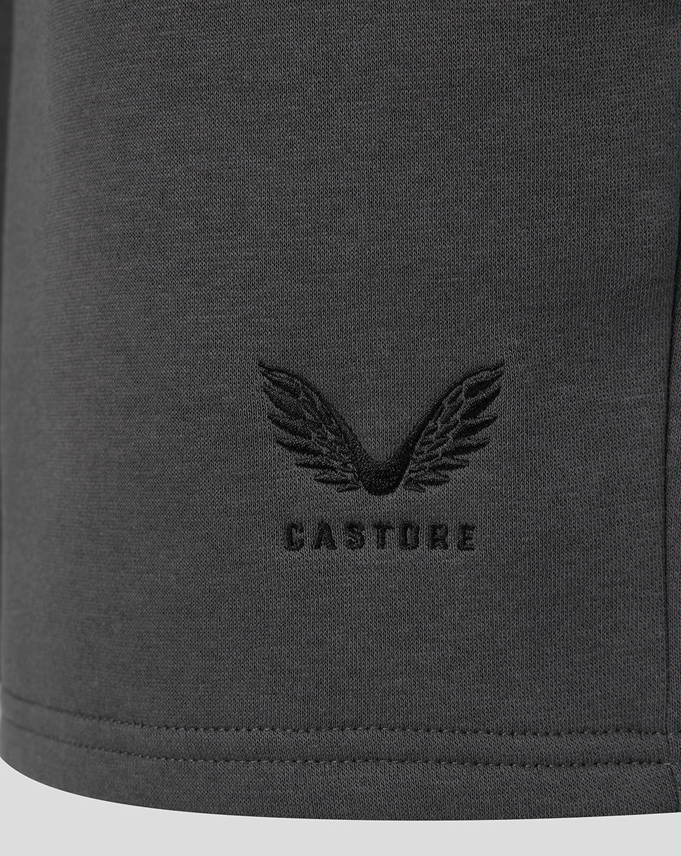 Castore wing emblem near the hem of the dark gray shorts.