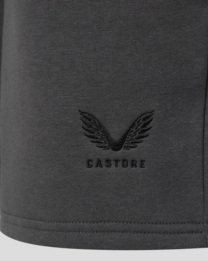 Castore wing emblem near the hem of the dark gray shorts.