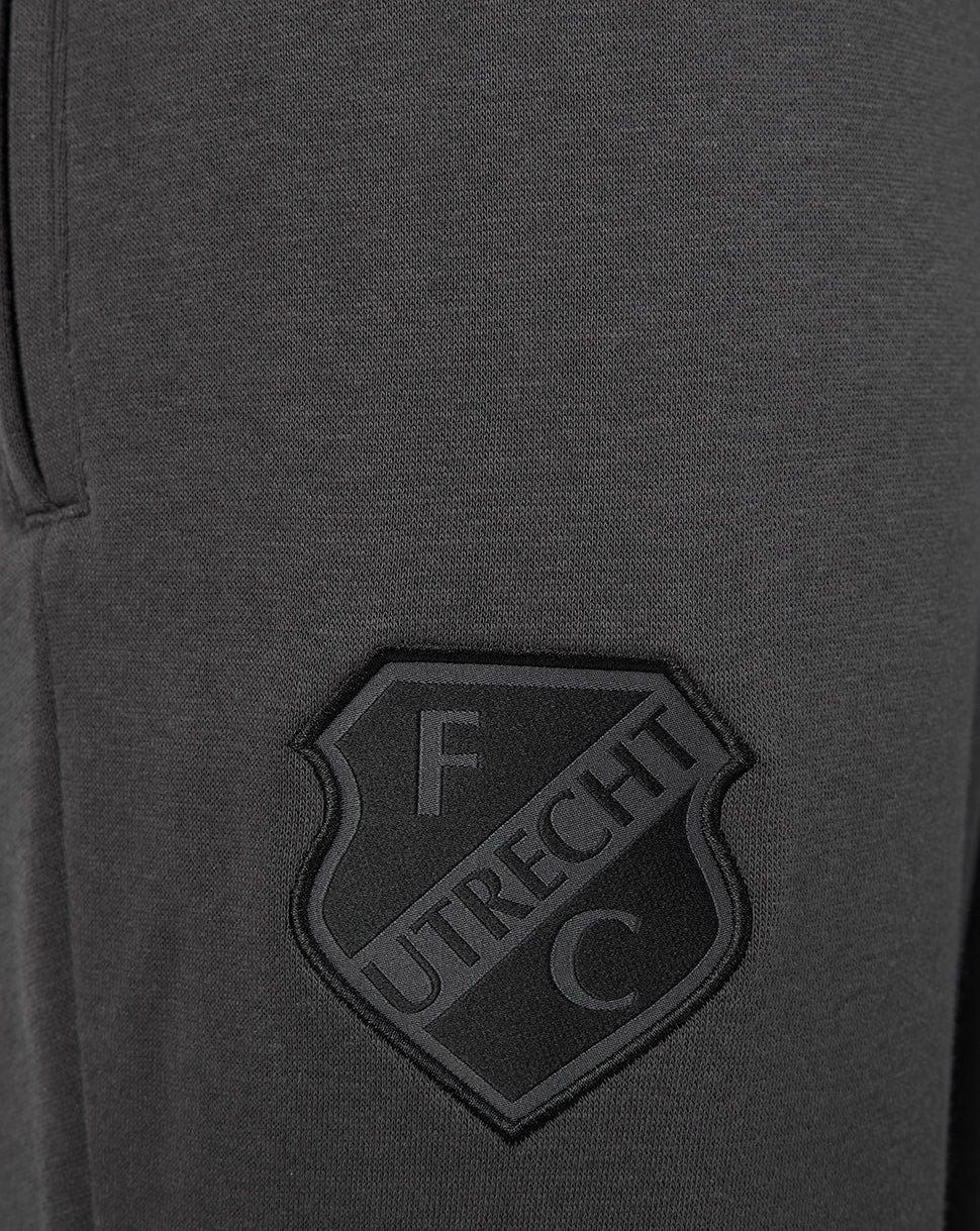 Dark grey FC Utrecht travel fleece shorts fabric with a raised shield crest patch.