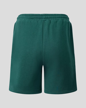 Back view of green Feyenoord travel fleece shorts with an elastic waistband and left leg crest.