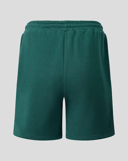 Back view of green Feyenoord travel fleece shorts with an elastic waistband and left leg crest.