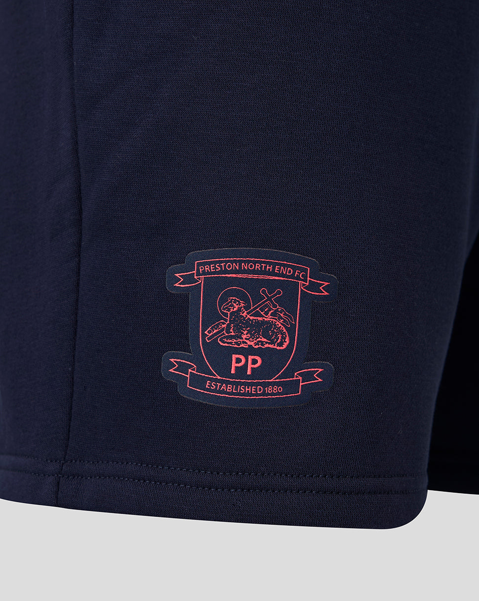 Navy blue shorts with a embroidered logo on a light gray background