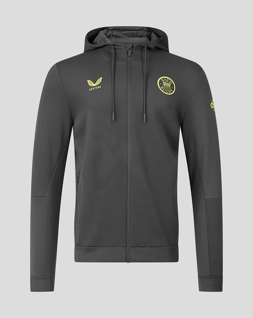 A dark gray full-zip hoodie with yellow-green accents, featuring a yellow-green castore logo on the left chest and a circular club crest on the right chest, displayed against a solid gray background.