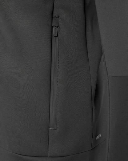 Close-up of a dark gray technical jacket fabric with a vertical zippered pocket and a small visible GORE-TEX logo near the lower right.