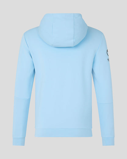 Light blue hoodie with a brand logo on the sleeve against a light gray background