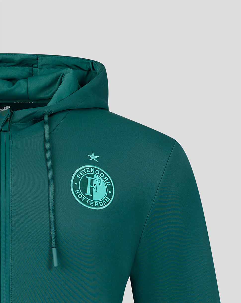 Close-up of the Feyenoord green travel hoodie chest area with a circular Feyenoord Rotterdam emblem and a star above.