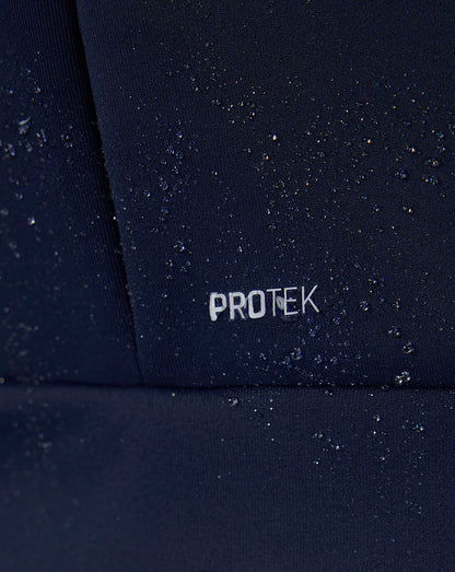 Close-up of a dark surface with 'PROTEK' branding.