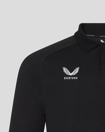 Black polo shirt with white logo and text on a light gray background