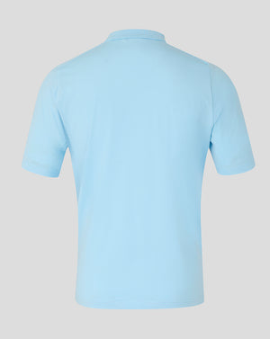 Light blue polo shirt on a light gray background