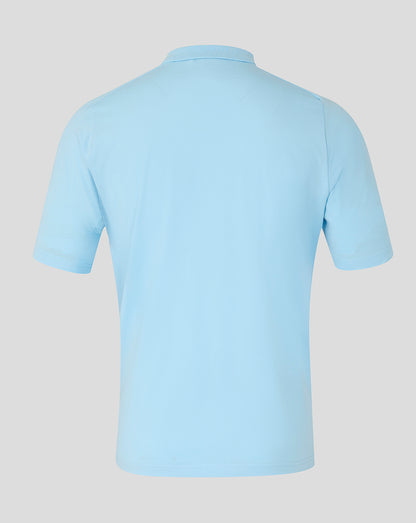 Light blue polo shirt on a light gray background
