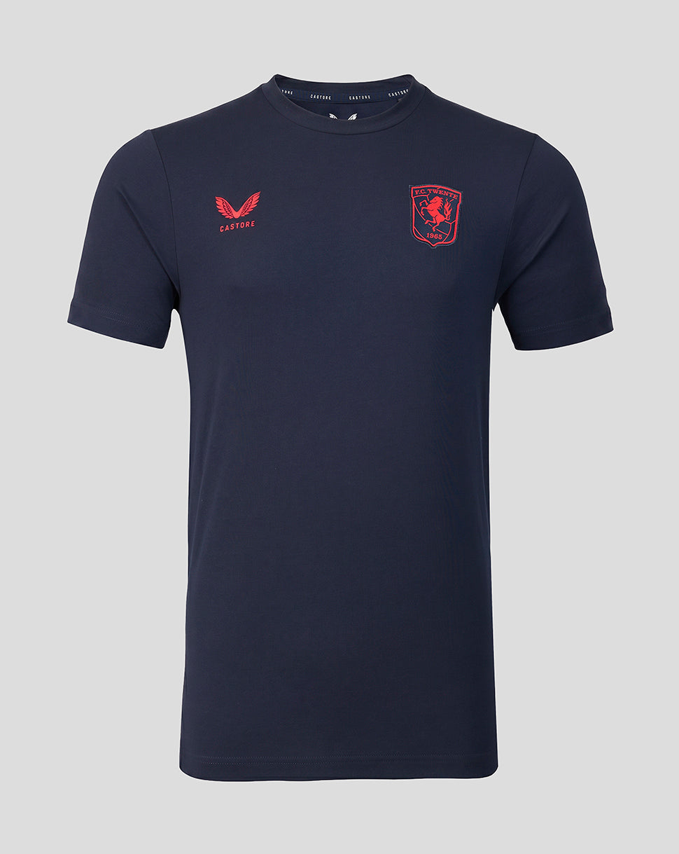 Navy FC Twente travel shirt front view with red club crest on the left chest and Castore logo on the right.