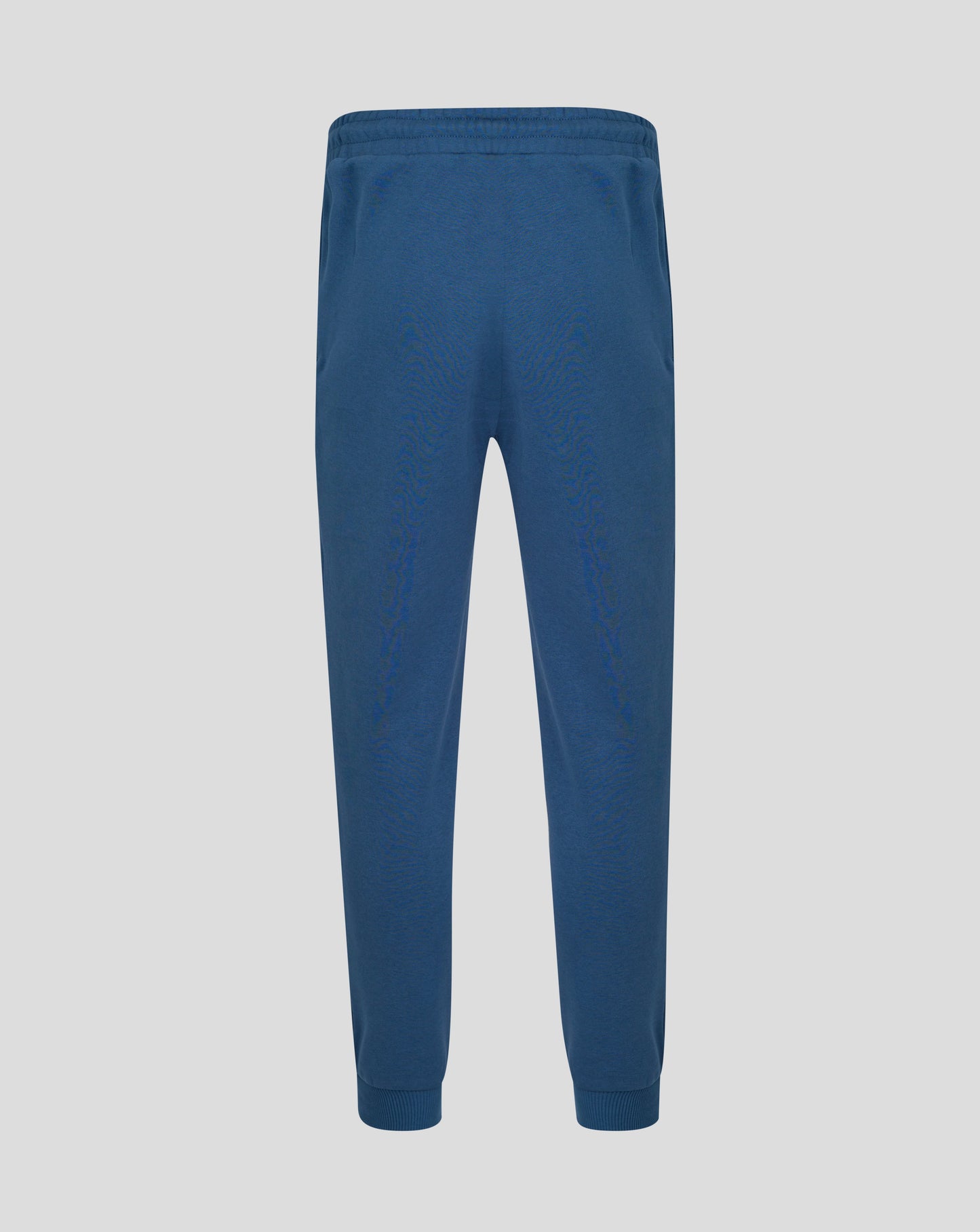 Blue sweatpants on a light gray background