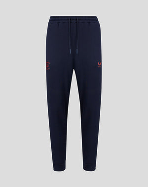 Navy blue jogger pants with red logo on a light gray background