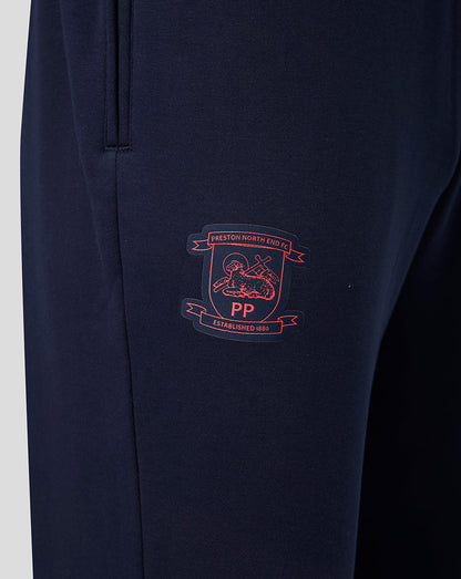Navy blue pants with a embroidered logo on a white background