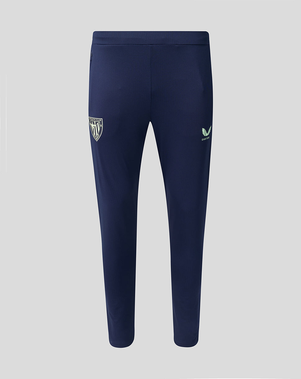 Pantalones de entrenamiento azul marino con escudo del Athletic Club en la pierna izquierda y Castore en la pierna derecha