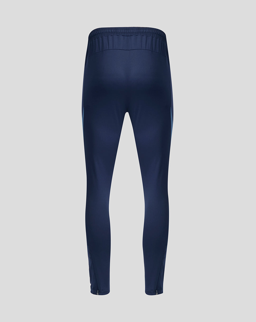 Back view of navy training pants with elastic waistband and tapered legs