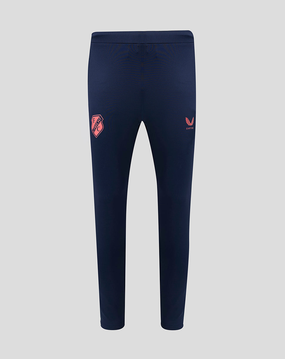 Front view of navy FC Utrecht training pants with pockets and a pink crest on the left thigh