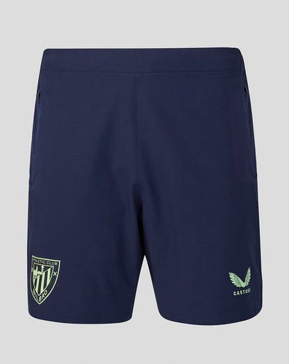 Back view of navy Athletic Club training shorts with a light green crest on the left leg and mint logo on the right