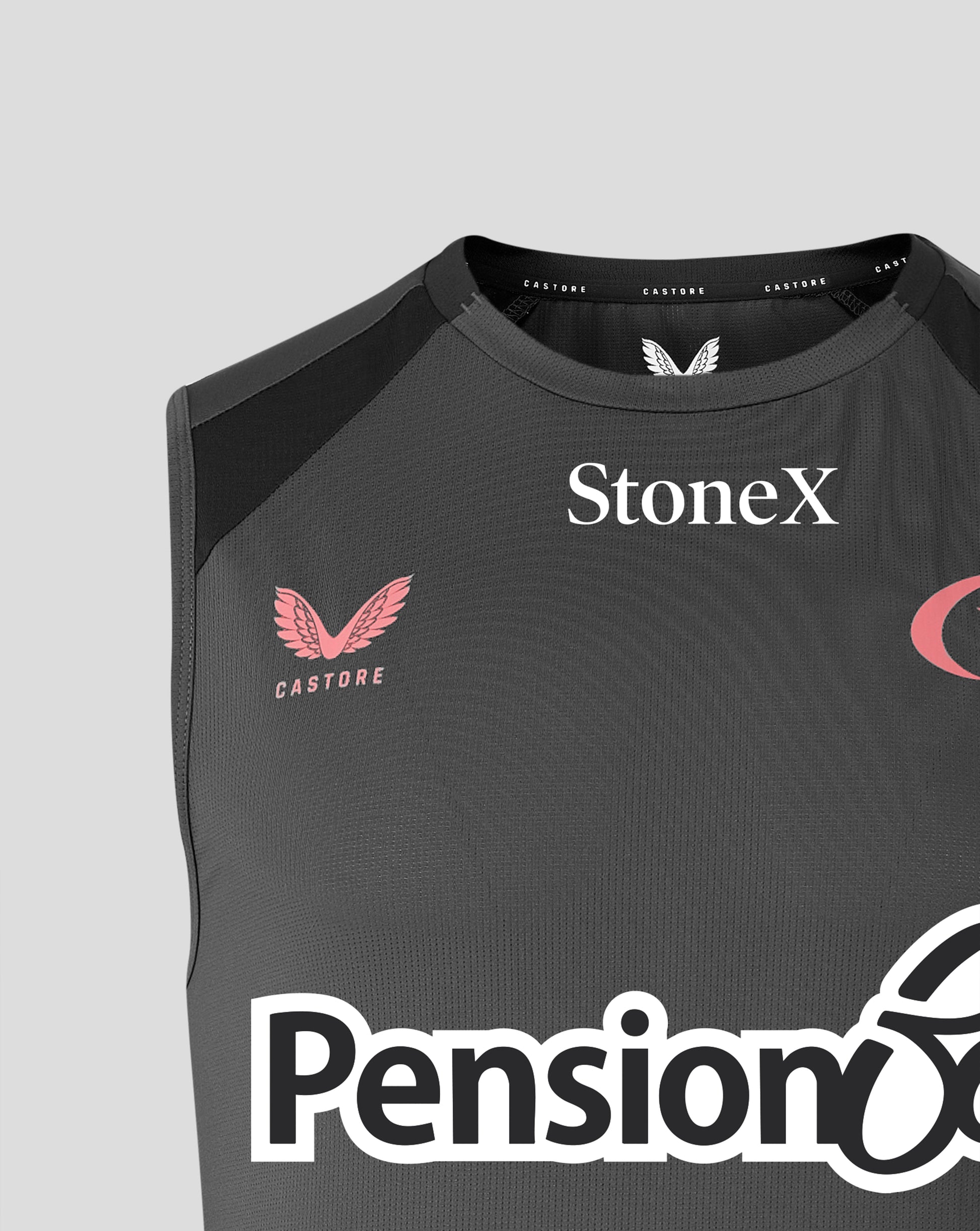 Close-up of a dark gray sleeveless athletic top with black shoulder panels, featuring the StoneX logo in white on the chest, a pink Castore wing logo, and part of the Pension6 logo at the bottom.
