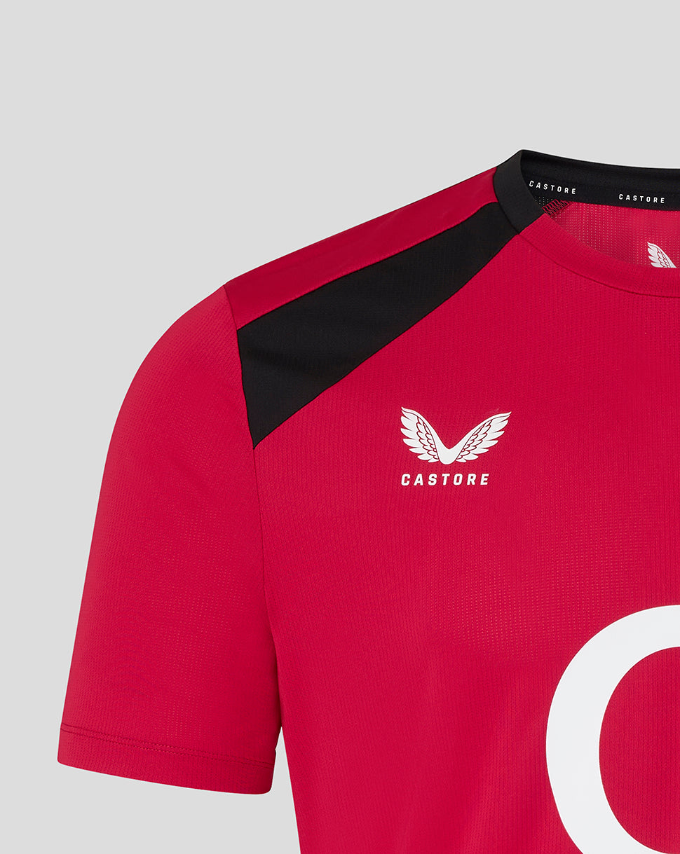 Red sports jersey with black shoulder panels and Castore logo on a gray background