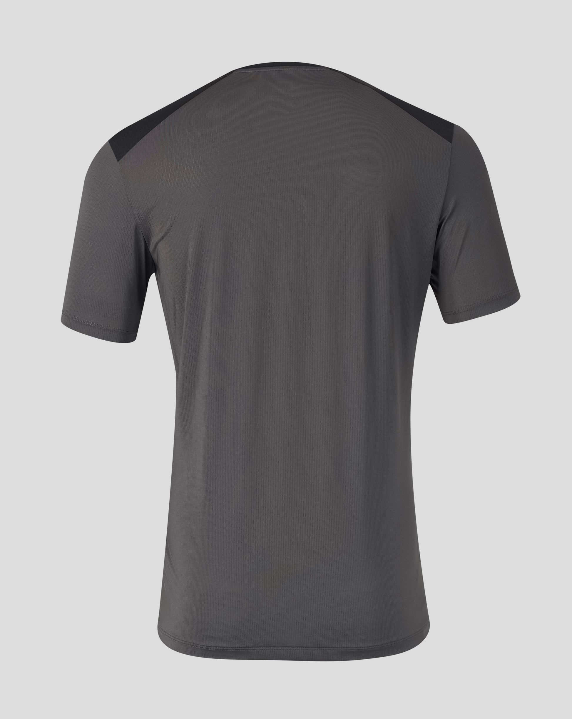 A dark gray athletic t-shirt shown from the back, featuring subtle wavy texture and contrasting dark shoulder panels, set against a solid light gray background.