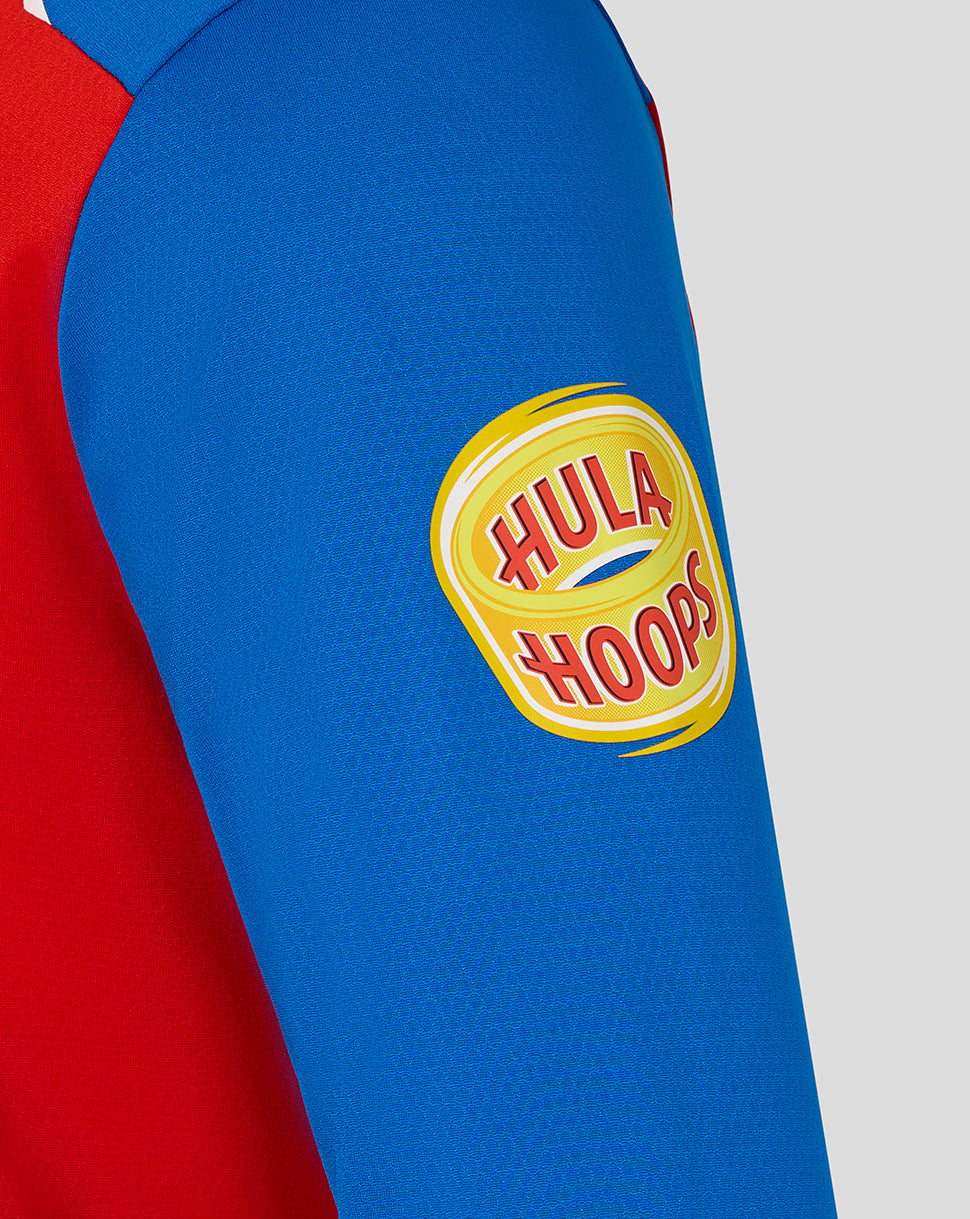Close-up of a blue and red sleeve with a Hula Hoops logo on a white background
