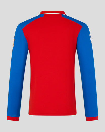 Red and blue long-sleeve shirt on a gray background
