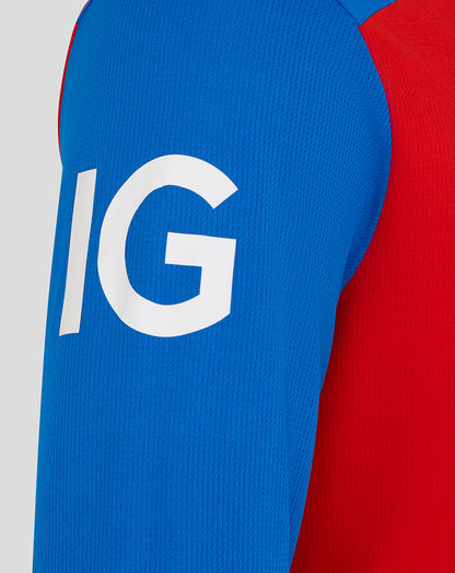 Close-up of a blue and red sleeve with a white 'IG' logo on a light gray background