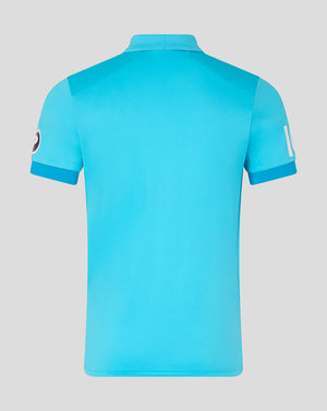 Blue polo shirt on a light gray background