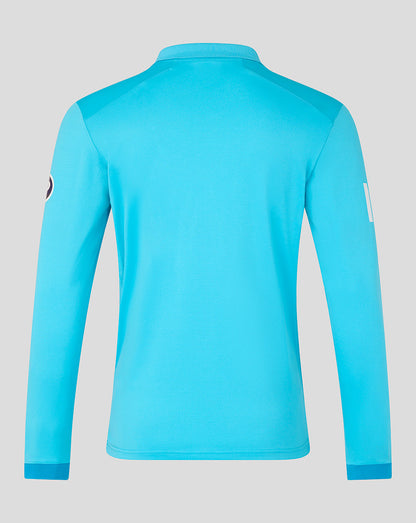 Blue long-sleeve shirt on a gray background