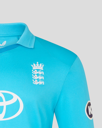 Close-up of a turquoise sports jersey with logos on a light gray background