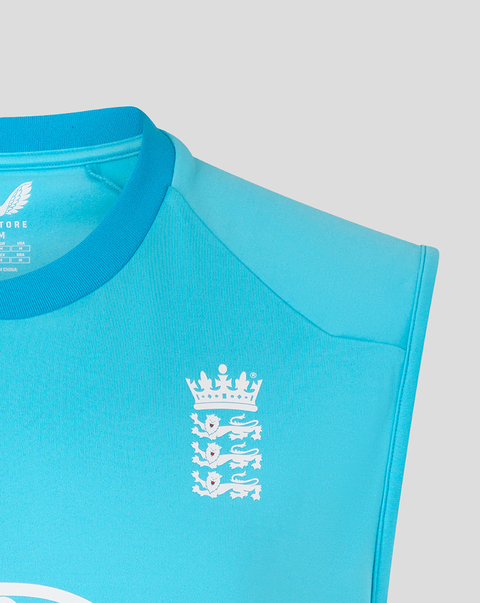 Close-up of a turquoise sports jersey with a white emblem on a light gray background